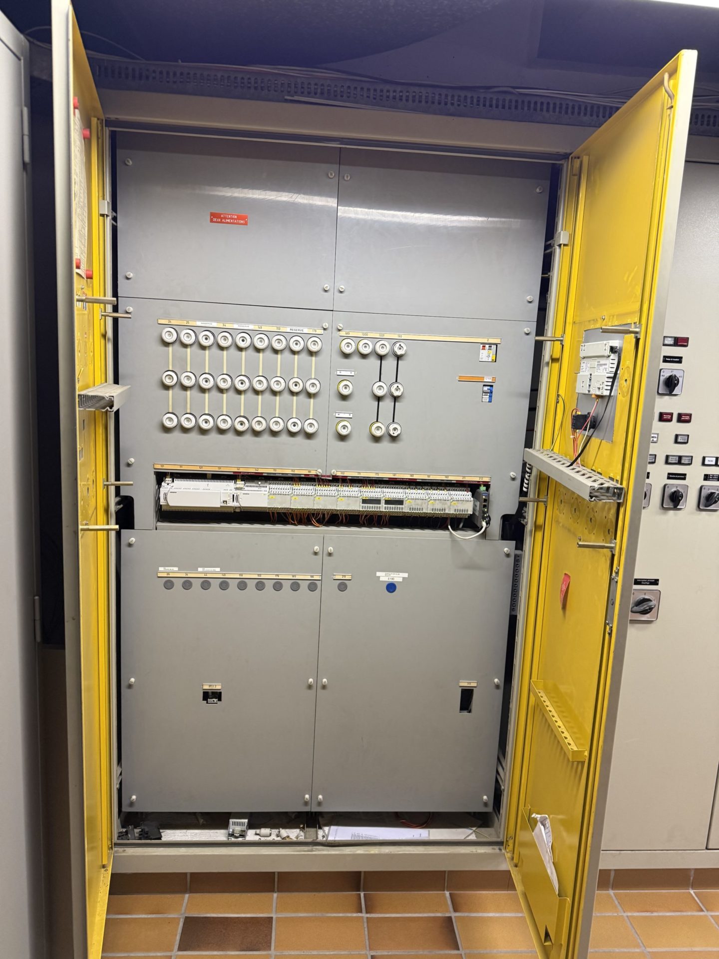 Open automation cabinet with controller modules and wiring